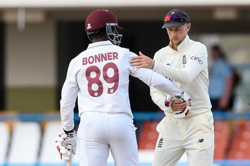 England captain Joe Root and West Indies batter Nkrumah Bonner shake hands after the drawn first Test in Antigua. AFP
