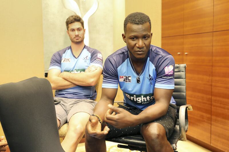 DUBAI , UNITED ARAB EMIRATES , SEP 9  ��� 2017 : - Darren Sammy , West Indies Cricket player ( right ) and Ben Cutting , Australian Cricket player ( left ) talking to media during the interview regarding World XI vs Pakistan series at the Intercontinental hotel in Festival City in Dubai. ( Pawan Singh / The National ) Story by Paul Radley