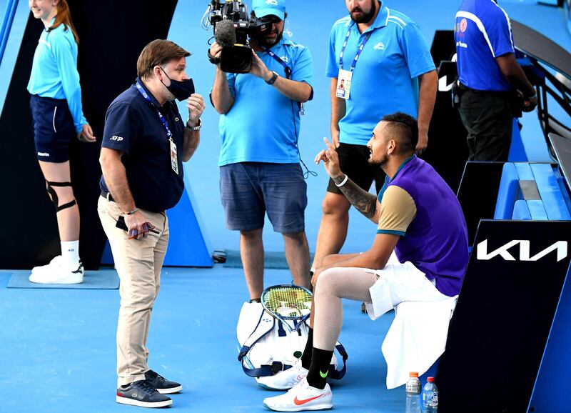 A tournament official talks with Nick Kyrgios during the Murray River Open. EPA