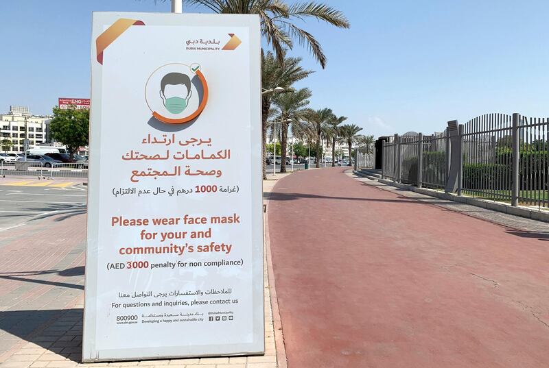 DUBAI, UNITED ARAB EMIRATES , October 10 – 2020 :- Message by Dubai Municipality about wearing face mask outside the Zabeel park in Dubai. Stickers about Covid safety measures pasted all over the park for the visitors. (Pawan Singh / The National) For News/Stock/Online.
