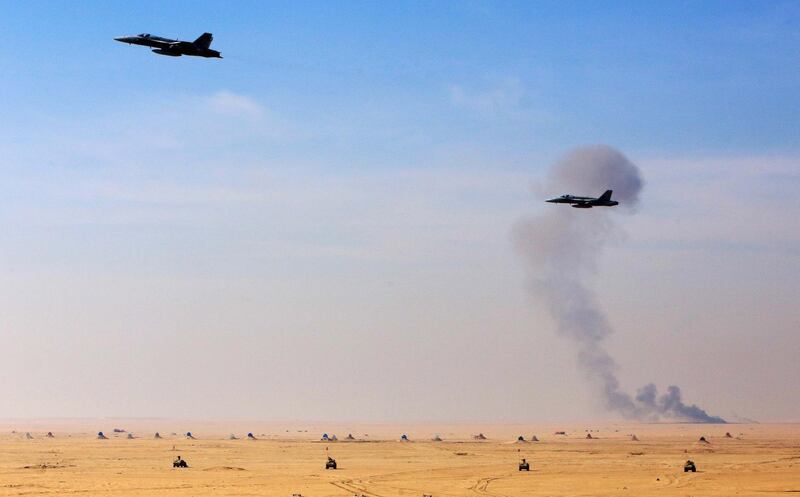 Kuwaiti F/A-18 fighter jets fly during the Kuwaiti and French army forces closing ceremony of a joint drill. AFP