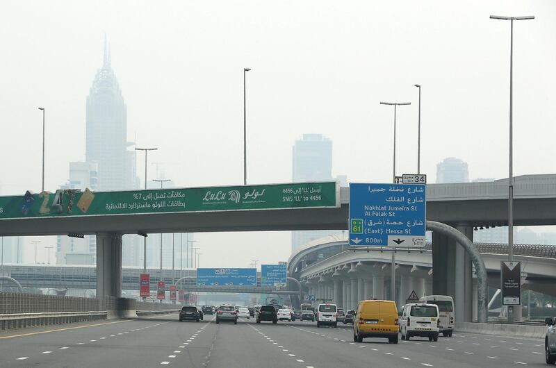 DUBAI, UNITED ARAB EMIRATES , August 10 – 2020 :- Traffic during the hazy weather on Sheikh Zayed road in Dubai. (Pawan Singh / The National) For News/Online