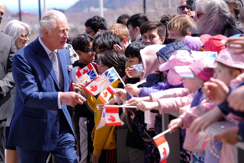 Prince Charles is greeted by well-wishers in St John's. AP