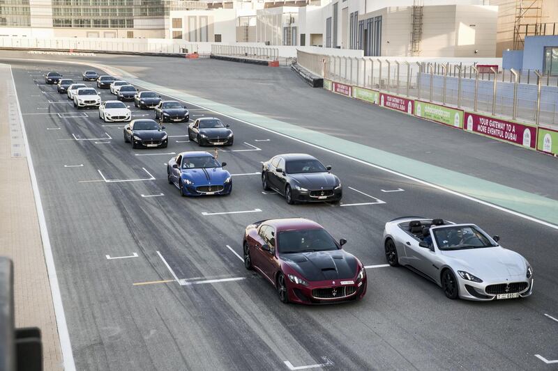 DUBAI, UNITED ARAB EMIRATES. 25 October 2017. Maserati Owners Club meet up event at the Dubai Autodrome. Cars line up on the track for a photo-op. (Photo: Antonie Robertson/The National) Journalist: Adam Workman. Section: Motoring.