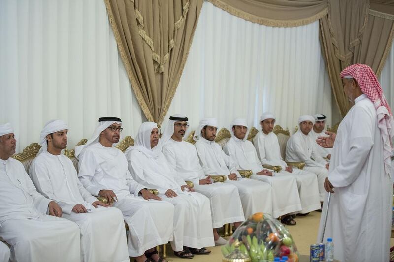 Sheikh Mohammed bin Zayed, Crown Prince of Abu Dhabi and Deputy Supreme Commander of the Armed Forces, third left, and Major General Sheikh Khaled bin Mohamed bin Zayed, Chairman of the State Security Department, fifth left, offer condolences to the family of martyr Mohammed Al Humoodi who died while serving with the Armed Forces in ‘Operation Restoring Hope’. Mohammed Al Hammadi / Crown Prince Court - Abu Dhabi