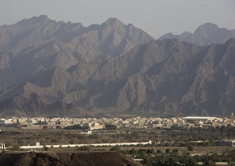 The spectacular Hajjar mountain range, which stretches for 500km, looms high over Hatta. Jeff Topping / The National