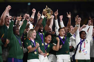 South Africa's flanker Siya Kolisi (C) lifts the Webb Ellis Cup as they celebrate winning the Japan 2019 Rugby World Cup final match between England and South Africa at the International Stadium Yokohama in Yokohama on November 2, 2019. / AFP / CHARLY TRIBALLEAU