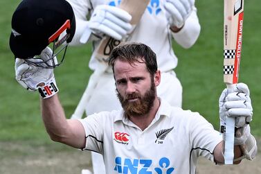 New Zealand's Kane Williamson celeberates making 100 runs against England on day 4 of their cricket test match in Wellington, New Zealand, Monday, Feb 27, 2023.  (Andrew Cornaga / Photosport via AP)