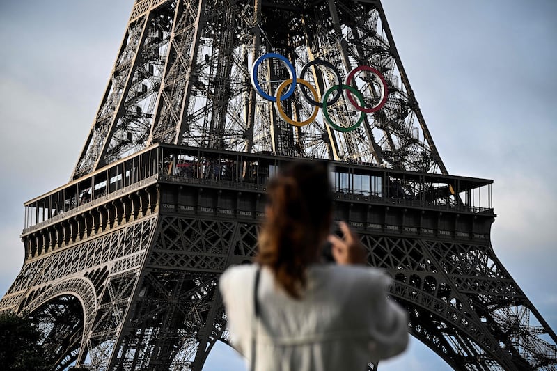 The Eiffel Tower decorated with the Olympic rings for the upcoming Paris 2024 Games. AFP