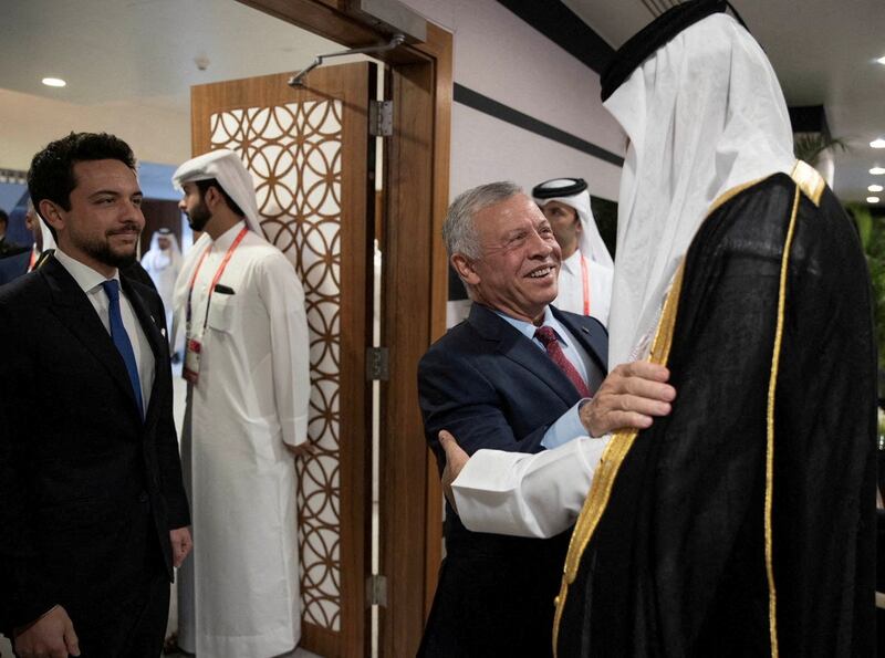 King Abdullah II of Jordan is welcomed by Sheikh Tamim to the World Cup in Doha. Qatar News Agency / Reuters