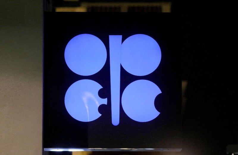 FILE - In this Dec. 19, 2019 file photo, the advertising label of the Organization of the Petroleum Exporting Countries, OPEC, shines at their headquarters in Vienna, Austria.  Leaders of the OPEC cartel are meeting virtually to decide how much oil their countries should produce as the coronavirus stifles demand for fuel. Theyâ€™re expected to extend production cuts into the new year in an effort to boost prices. (AP Photo/Ronald Zak, File)