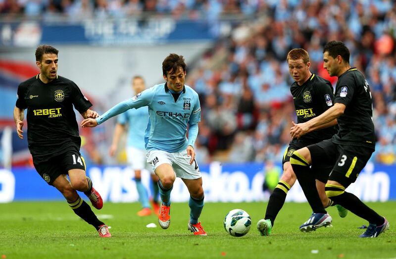 LONDON, ENGLAND - MAY 11:  David Silva of Manchester City is watched by Jordi Gomez (L), James McCarthy (2R) and Antolin Alcaraz of Wigan Athletic (R) during the FA Cup with Budweiser Final between Manchester City and Wigan Athletic at Wembley Stadium on May 11, 2013 in London, England.  (Photo by Alex Livesey/Getty Images)