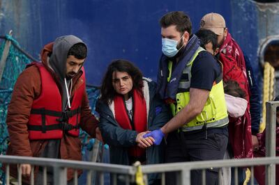 A group of people thought to be migrants are brought in to Dover in Kent following a small boat incident in the Channel on January 4, 2022.  PA