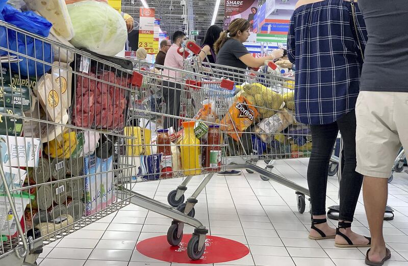 DUBAI, UNITED ARAB EMIRATES , March 23 – 2020 :- People doing shopping at the Carrefour supermarket in Ibn Battuta mall in Dubai. (Pawan Singh / The National) For News/Online/Instagram. 