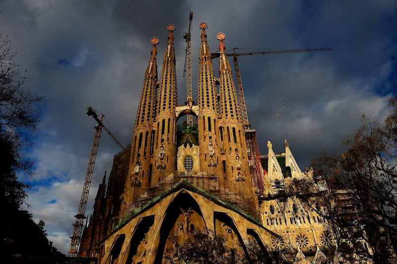 FILE - In this file photo taken Jan. 13, 2010 shows Antoni Gaudi's Sagrada Familia church, an unfinished Barcelona landmark in Barcelona, Spain. An official building permit has been issued for the unfinished Barcelona church designed by architect Antoni GaudÃ­ 137 years after construction started on La Sagrada Familia Basilica. Barcelona City Hall says it granted the current builders a permit valid through 2026. The basilica's first stone was laid in 1882, but the city says there is was no record a construction license ever was granted. (AP Photo/Manu Fernandez, File)