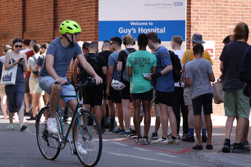Crowds queue for monkeypox vaccinations at Guys Hospital on July 24 in London. Getty Images