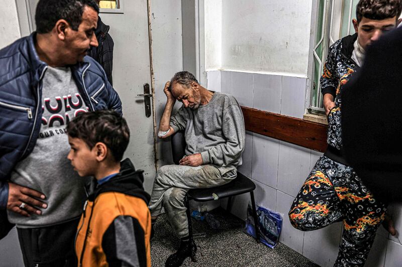 A Palestinian man detained by the Israeli military awaits treatment for his injuries in Rafah. AFP