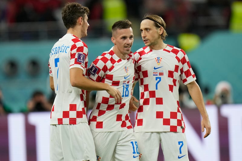 Mislav Orsic (c) celebrates with teammates after scoring Croatia's second goal. AP
