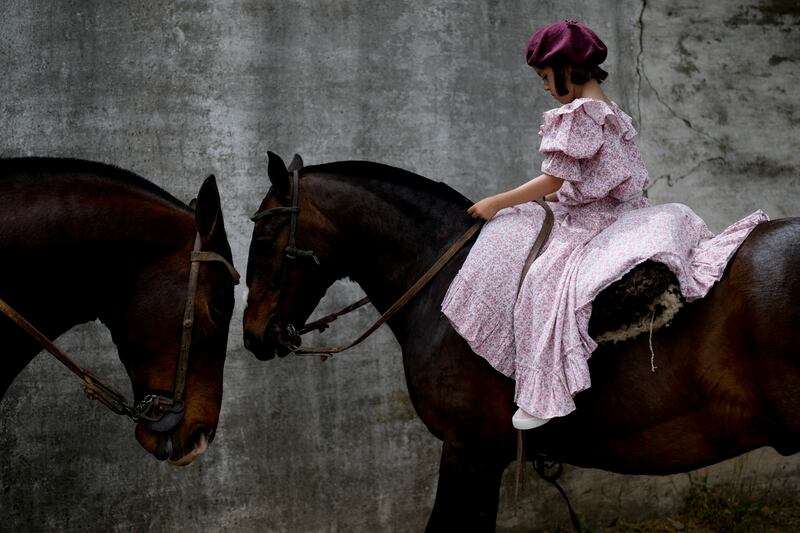 A girl rides during Tradition Day, which aims to preserve the gaucho culture of Argentina, in San Antonio de Areco. AP Photo