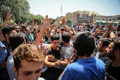 Protests against the state of Iran's economy at the main gate of a bazaar in Tehran in 2018. Almost six years later, the situation hasn't improved. AP
