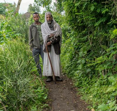 Lelamo Mukhtar with his son Fouwad, who has taken over farming and supporting the family after his father became ill with lymphatic filariasis. Photo: End Fund