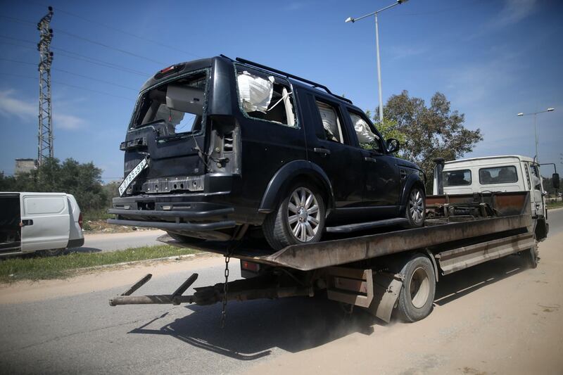 One of the cars of the Palestinian Prime Minister's convoy that was hit by an explosion being towed away to the Gaza strip Erez crossing, in Beit Hanun, the northern access point into the coastal Palestinian territory. Mohammed Abed / AFP