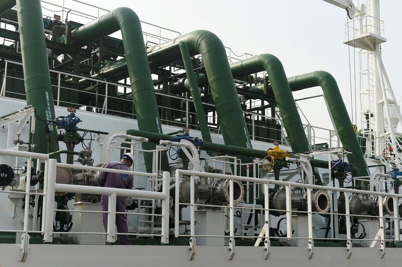 FILE PHOTO: A worker works on a liquefied natural gas (LNG) tanker at a port of the China National Offshore Oil Co (CNOOC) in Tianjin, China November 6, 2017. REUTERS/Stringer/File Photo ATTENTION EDITORS - THIS IMAGE WAS PROVIDED BY A THIRD PARTY. CHINA OUT.