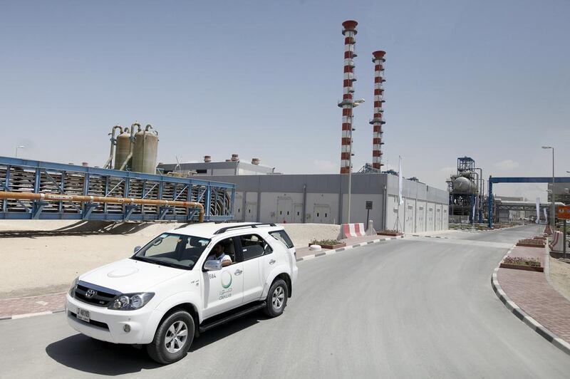 Above, the Dubai Electricity and Water Authority's M-Station, the largest power production and water desalination plant in the UAE. Dewa is studying the feasibility of using geothermal energy to power desalination plants. Sarah Dea / The National