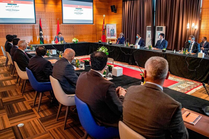 Nasser Bourita, Morocco's Minister of Foreign Affairs and International Cooperation, chairs a meeting of representatives of Libya's rival administrations in the coastal town of Bouznika, south of Rabat, on September 6, 2020. The meeting takes place more than two weeks after both sides announced a surprise ceasefire. Dubbed "Libyan Dialogue", the talks brought together five members of the Tripoli-based Government of National Accord (GNA) and five from a parliament headquartered in the eastern Libyan city of Tobruk. / AFP / FADEL SENNA
