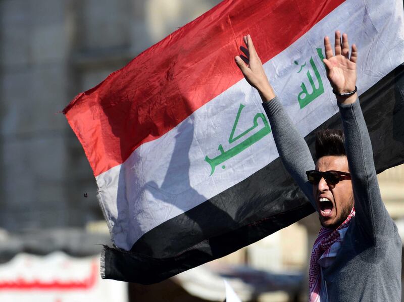 An Iraqi university student shouts slogans during a protest in central Baghdad, Iraq.  EPA