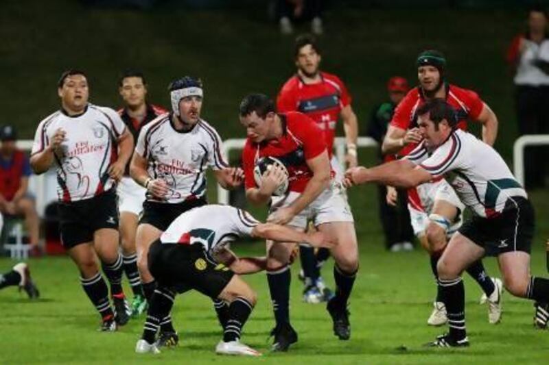 UAE, in white, failed to stop Hong Kong from beating them 51-6 in December at Dubai but have reportedly improved with intense training in Cyprus last month. Mike Young / The National