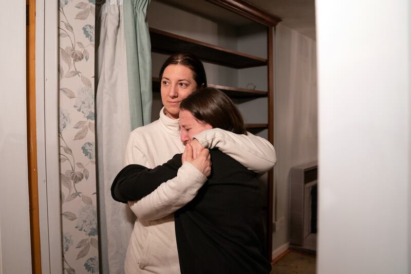 Valeriia Starkova hugs her daughter Kamila.