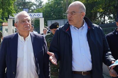 epa08505358 A handout photo made available by the Greek Foreign Ministry shows Greek Foreign Minister Nikos Dendias (R) and EU High Representative for Foreign Affairs and Security Policy Josep Borrell (L) visit the border post at Kastanies, Evros, Greece, 24 June 2020. EU High Representative for Foreign Affairs and Security Policy Josep Borrell visit the border post at Kastanies, Evros, accompanied by Greek Foreign Minister Nikos Dendias, and will be briefed by the Greek police. The two officials walked up to the 'chain' at the border crossing, where are the last Greek soldiers before the border with Turkey are stationed.  EPA/CHARIS AKRIVIADIS/ HANDOUT  HANDOUT EDITORIAL USE ONLY/NO SALES