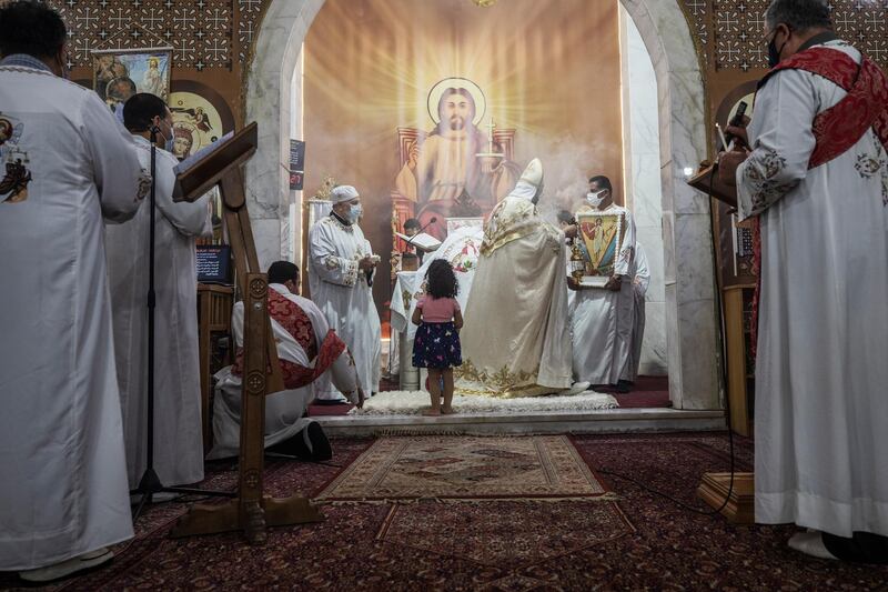 Coptic Orthodox priest Lucas Adel leads prayers during Easter Mass at Holy Cross Church in Cairo. AP
