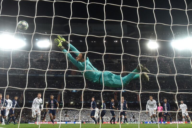 Keylor Navas of PSG reaches for the ball as Gareth Bale of Real Madrid hits the post from a freekick. Getty