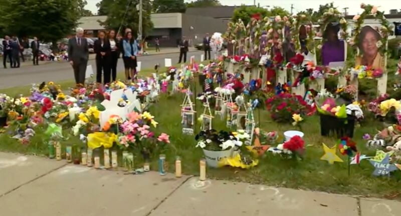 US Attorney General Merrick Garland places flowers at a memorial for the shooting victims earlier this year. AP