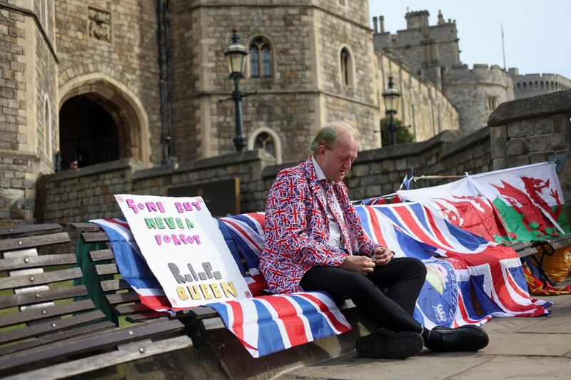 Royal fan Bartley Graham outside Windsor Castle, south-east England, marks the first anniversary of Queen Elizabeth's death. Reuters