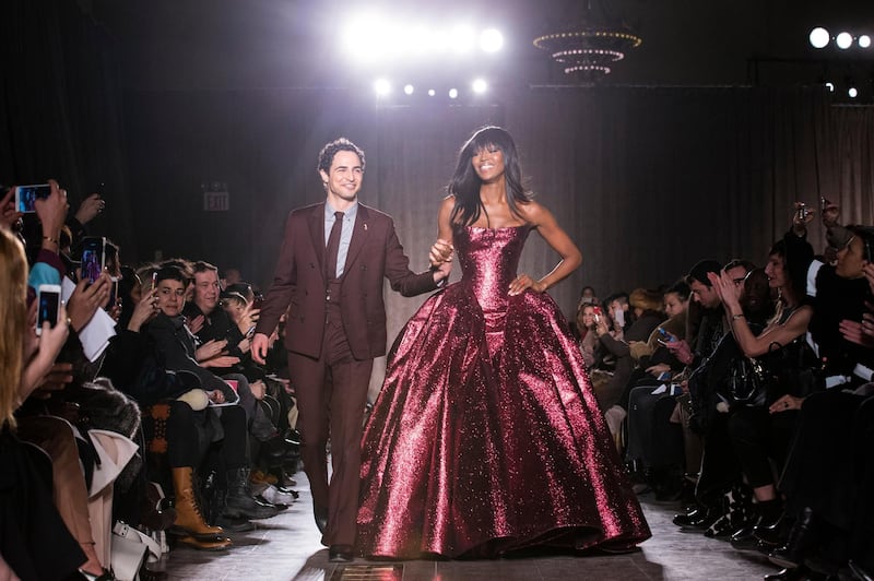 Zac Posen and model Naomi Campbell on the runway after his autumn 2015 New York fashion week show. AP