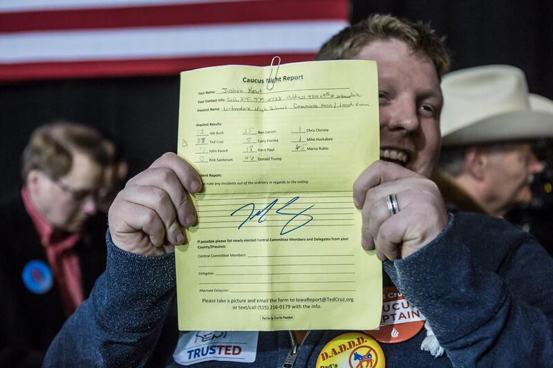 A supporter shows an Iowa caucus report from his precinct signed by Republican presidential candidate Senator Ted Cruz at a caucus night rally on February 1 in Des Moines, Iowa. Cruz beat out frontrunner Donald Trump and other contenders to win the Iowa caucuses. Brendan Hoffman / Getty Images / AFP