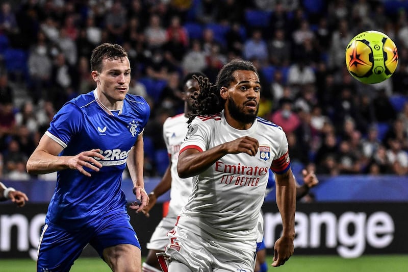 Lyon's Belgian defender Jason Denayer  vies with Rangers FC's George Edmundson during their friendly at the Groupama stadium in Decines-Charpieu, France, on Thursday. AFP