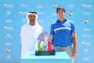 Sheikh Fahim bin Sultan Al Qasimi, chairman of the Emirates Golf Federation, alongside Ricardo Gouveia of Portugal after his victory in the Abu Dhabi Challenge on April 30, 2023. Getty 