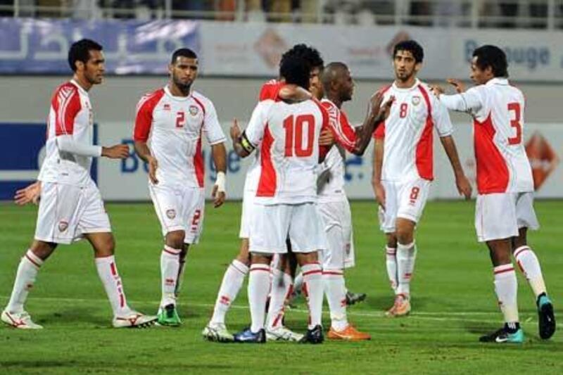 The UAE national football team celebrate their victory over Syria in Al Ain last night.
