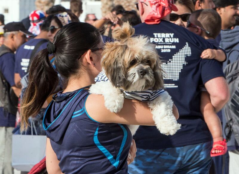 ABU DHABI, UNITED ARAB EMIRATES - Even pet is included in the run at the Terry Fox Run, Corniche Beach.  Leslie Pableo for The National