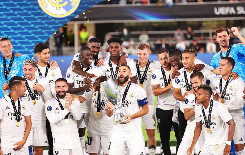 Real Madrid captain Karim Benzema lifts the Uefa Super Cup trophy. Getty Images