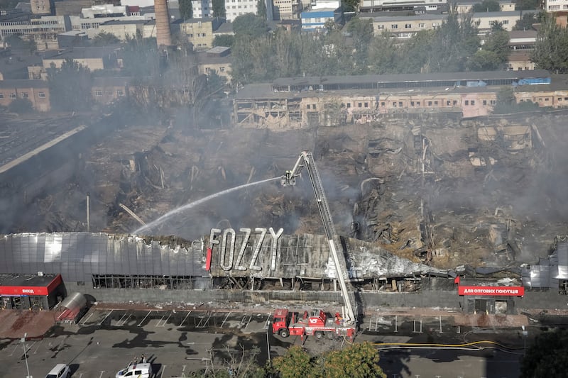 First responders work at the site of a shopping centre destroyed by a Russian attack in Odesa. Reuters