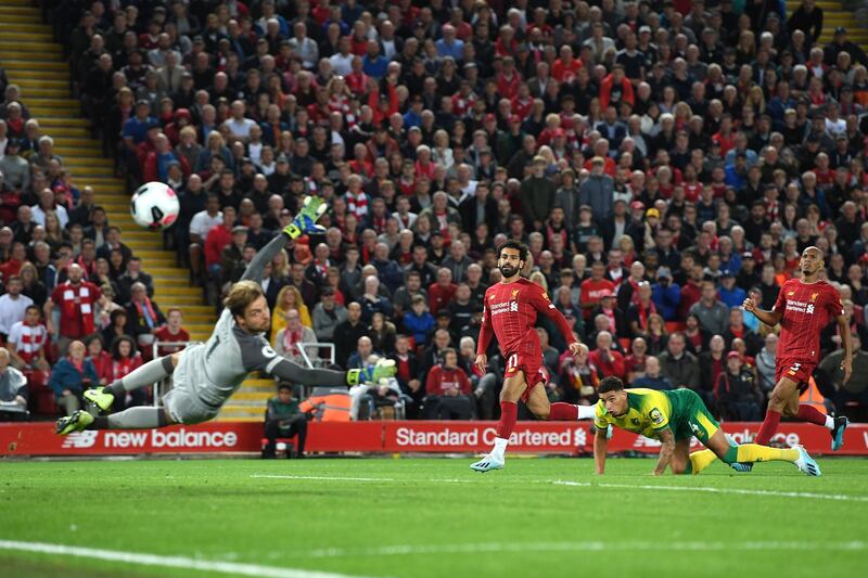 Mohamed Salah watches on as his shot curls just wide of the Norwich post. Getty Images
