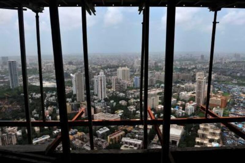 TO GO WITH India-property-housing-luxury,FEATURE by Salil Panchal



Residential apartment blocks seen from an under construction luxury apartment tower in Mumbai on August 9, 2010.  The heart of Mumbai city, once a cotton mill hub, is seeing a rapid change in its skyline as more than 30 skyscrapers are  mushrooming out of slumland in the city's most congested district. The transformation reflects breakneck pace of growth in Asia's third largest economy, as India's property and capital markets boom, and developers build dream homes for a rapidly-growing list of Indian millionaires.  AFP PHOTO/Punit PARANJPE

 *** Local Caption ***  474699-01-08.jpg