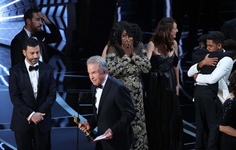 Members of the casts and crew from Moonlight including Joi McMillon react as presenter Warren Beatty announces that Moonlight won the Best Picture award. Reuters