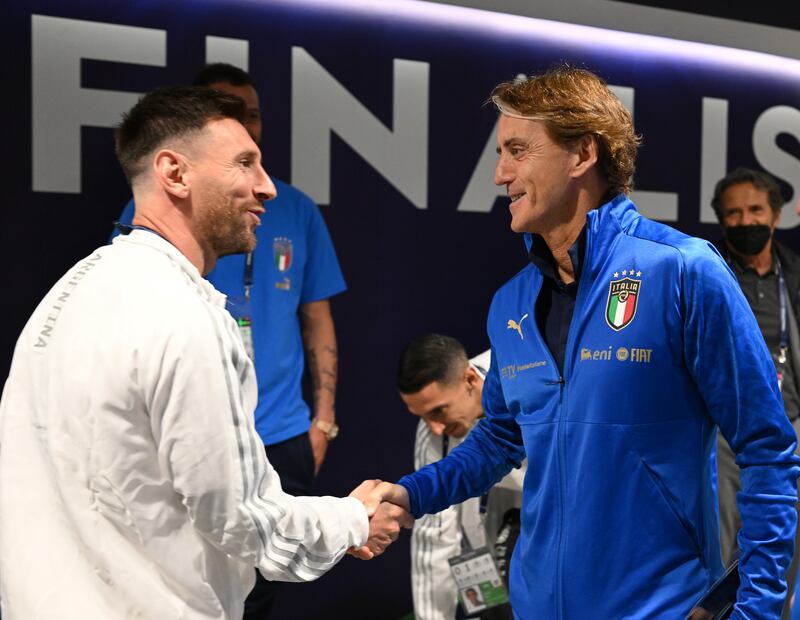 Italy head coach Roberto Mancini and Lionel Messi of Argentina shake hands. Getty Images