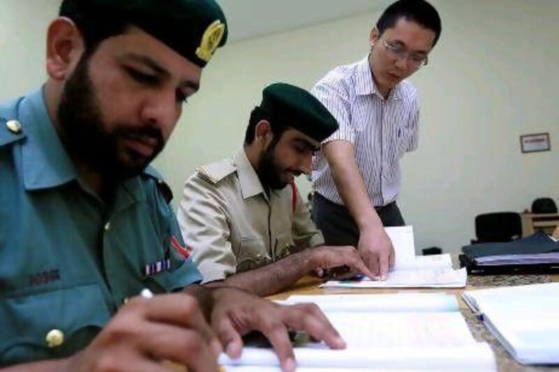 Dubai Police attends the Chinese class at the Dubai Police Academy in Dubai. Satish Kumar / The National